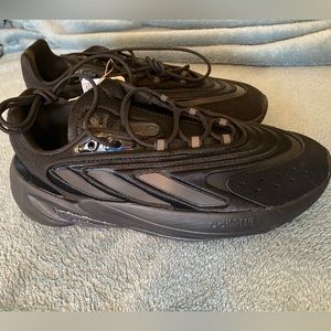 Brand new in the box Adidas Ozelia black shoes, size 8.5.